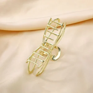 Broche metal dorado